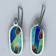 Load image into Gallery viewer, Pair of earrings with blue, green, and brown design on a gray background
