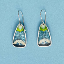Load image into Gallery viewer, Pair of earrings with a nature-themed design on a blue background
