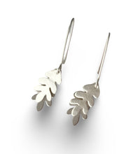 Load image into Gallery viewer, Silver leaf-shaped earrings on a white background
