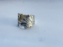 Load image into Gallery viewer, Silver ring with leaf design on a light gray background
