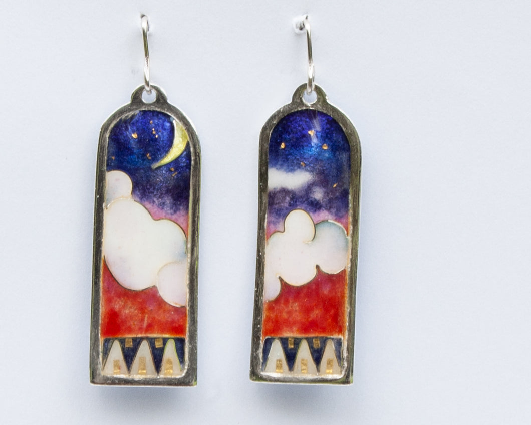 silver and enamel earrings withe 24k accents show on evening sky with the moon rising